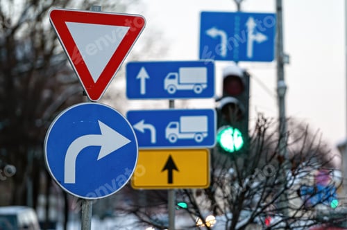 Preview: Cars moving on the road in city in winter. View to the traffic with signs, trafficlights and cars