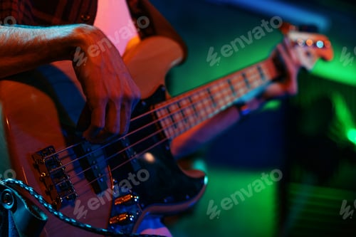 Preview: Bass Player In Stage With Colorful Lights