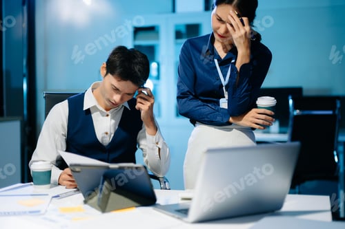 Preview: Asian business colleagues feeling stress and exhaustion from workload, overworked team facing