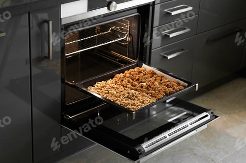Preview: Roasted baked walnuts close up on a baking sheet