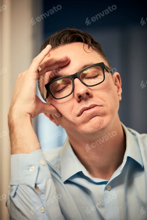 Preview: Man resting on elbow with eyes closed