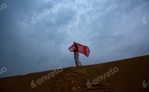 Preview: Woman tourist enjoying vacation in Thar desert, Rajathan, India.