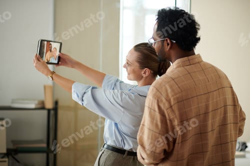 Preview: Coworkers Taking Selfie