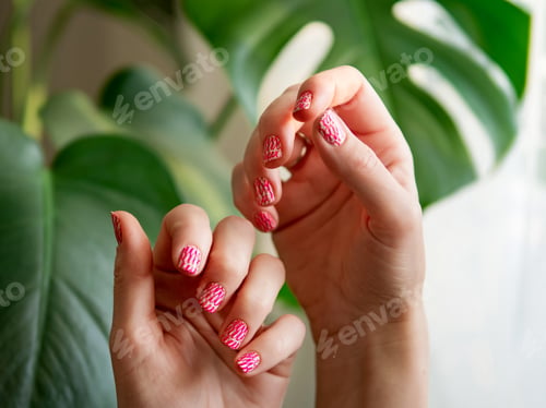 Preview: Hands with pink neon stamping nails manicure
