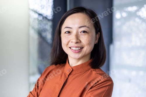 Preview: Portrait of young beautiful and successful Asian business woman, female employee smiling and