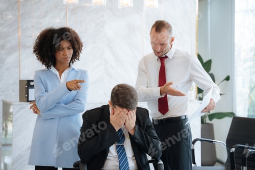 Preview: business team sitting sad and solving problems in the office.