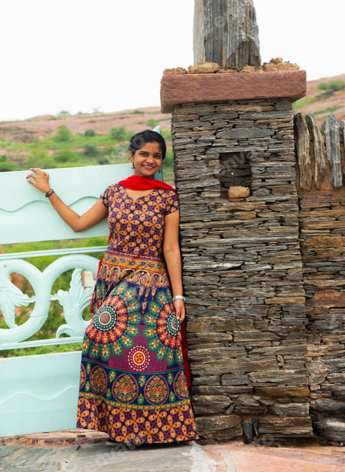 Preview: Woman in front of old stone wall