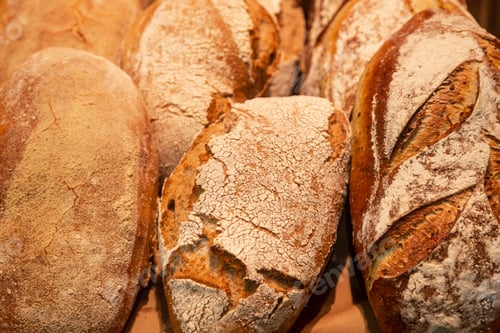 Preview: Background of loaves of bread on a bakery showcase.