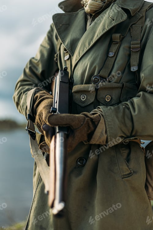 Preview: Soldier Of USA Infantry Of World War II Holds Submachine Weapon In Hands