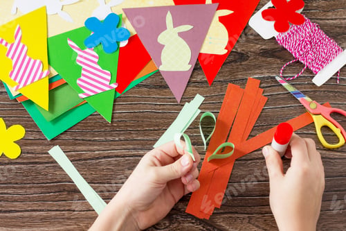 Preview: Festive Easter garland handmade with decoration of colorful rabbits and carrot.