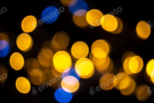 Preview: Perfect bokeh for festive New Year and Christmas background. Defocused yellow and blue light circles