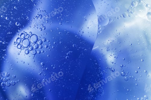 Preview: Oil bubbles close up. circles of water macro. abstract light blue background