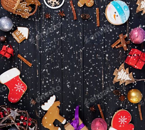 Preview: Christmas gift, toys, gingerbread cookies, spices and decorations on wooden background