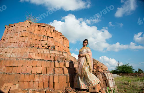 Preview: Beautiful Indian bride on bricks background