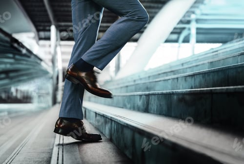 Preview: Motivation and challenging Concept. Steps Forward into a Success. Low Section of Businessman