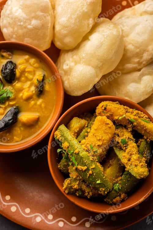 Preview: Cholar dal and patol aloo sabzi served with fried Luchi or poori, bengali food
