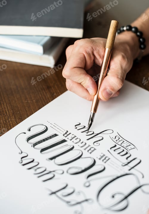 Preview: Closeup of a calligrapher working on a project