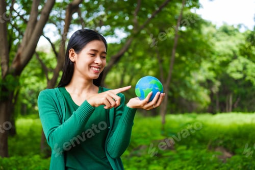 Preview: A male hand holds a hammer, symbolizing the enforcement of tree conservation laws. This highlights