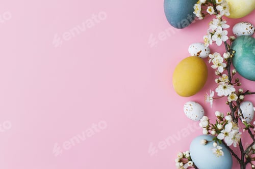 Preview: Happy Easter! Easter eggs and cherry blossom flat lay on pink background. Modern easter background