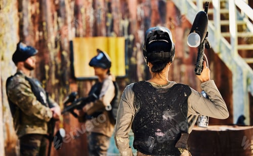 Preview: Paintball, back view or woman with gun in game or competition for fitness, exercise or cardio worko