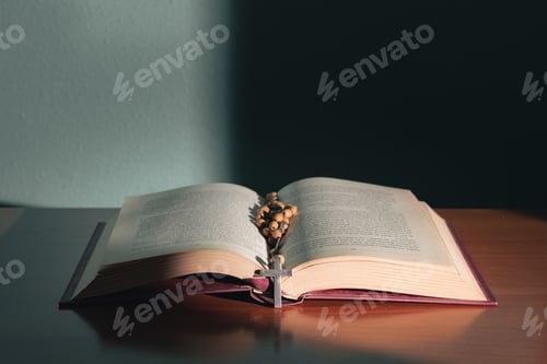 Preview: Cross on the holy bible on a wooden table