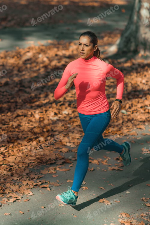 Preview: Woman Jogging Outdoors in Park