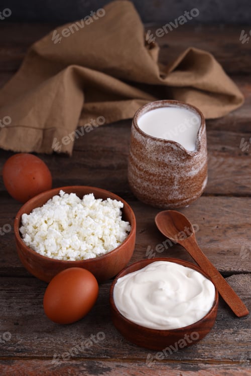 Preview: Cottage Cheese, Cream, and Eggs on Wooden Table