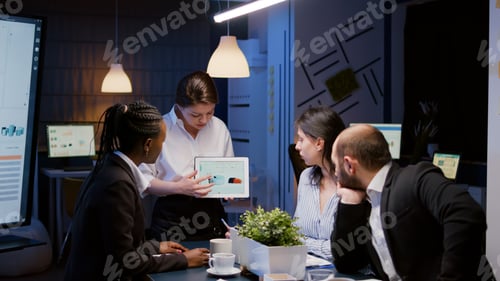 Preview: Workaholic focused businesswoman holding tablet explaining company graph overworking in business