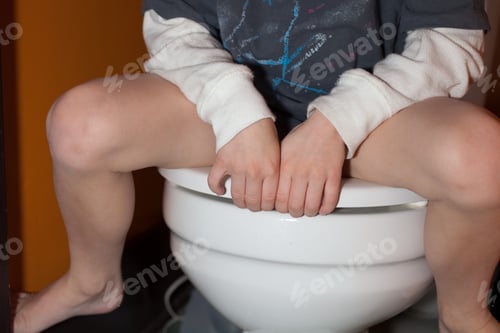 Preview: Boy sitting on toilet