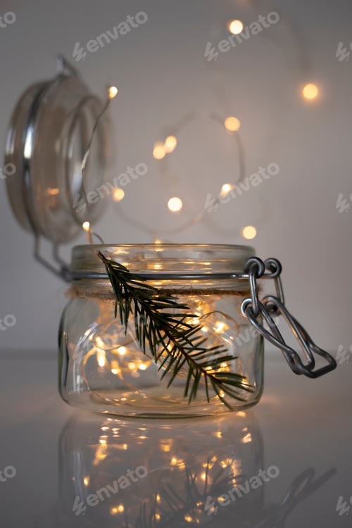 Preview: Glass jar with lights inside. The concept of New Year and Christmas.