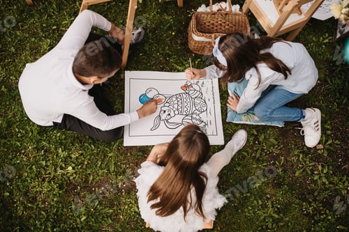 Preview: Children drawing bunny on canvas on grass