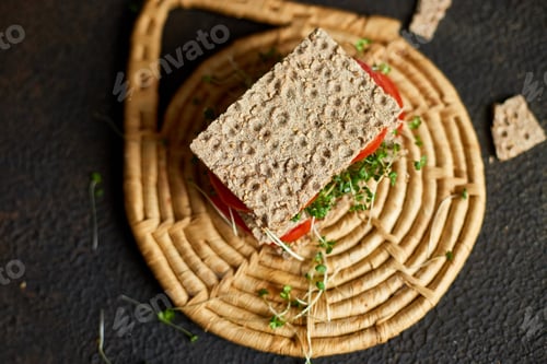 Preview: Healthy vegan sandwich with crisp rye bread tomatoe and microgreens