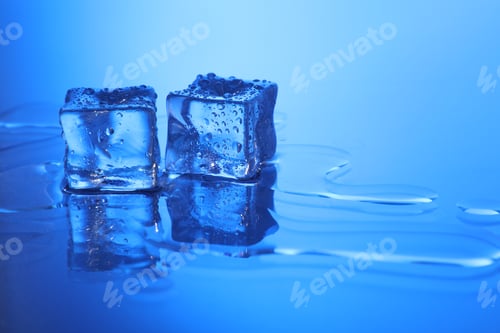 Preview: Cubes of clear ice on light blue background, space for text