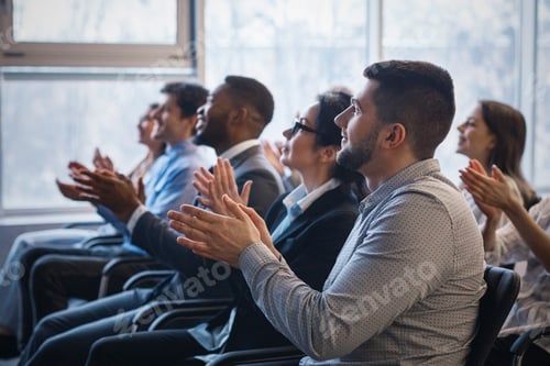 Preview: Business conference. Colleagues clapping hands to speaker