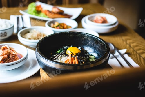 Preview: Traditional Korean Bibimbap vegetables with raw egg yolk