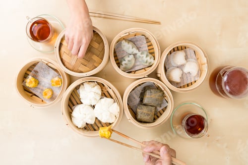 Preview: Top view of people eating dim sum