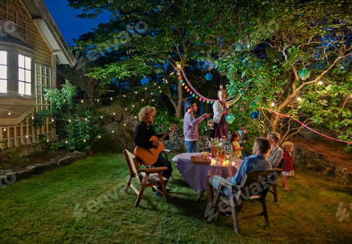 Preview: Family group preparing for evening garden party