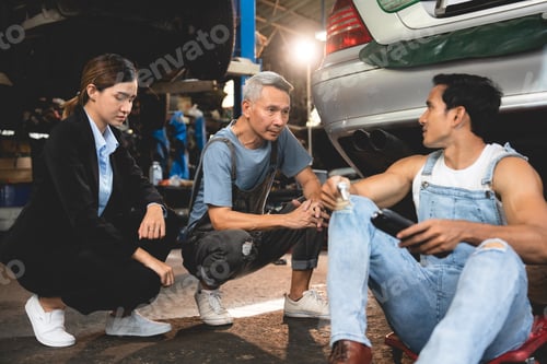 Preview: Asian woman customer talking with professional mechanic worker or workshop owner, client checking