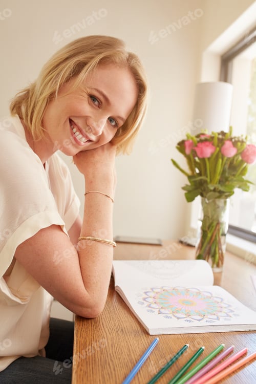 Preview: Relaxed woman with adult coloring book