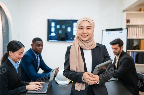 Preview: Successful asian businesswoman working and looking camera in a meeting room.