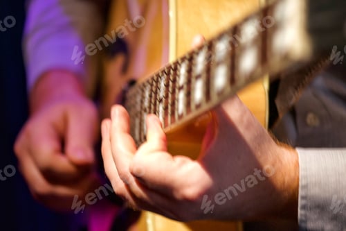 Preview: Unrecognizable jazz guitarist plays music on guitar at a downtown city nightclub