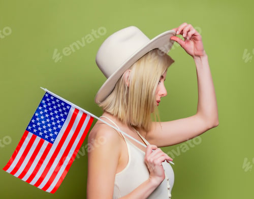 Preview: Beautiful cowgirl in a hat with United States of America flag
