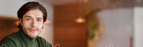 Preview: Close up portrait of serious guy sitting at cafe