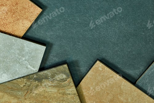 Preview: Frame of various different decorative tiles samples on stone background.