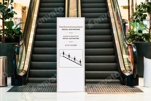 Preview: Escalator with Social Distancing Sign in a Building