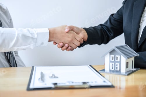 Preview: Real estate agent are shaking hands after good deal and giving house
