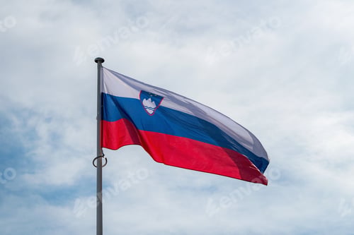 Preview: The national flag of Serbia waving in the blue sky