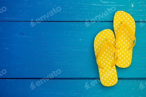 Preview: Beach flip-flops on blue wooden background