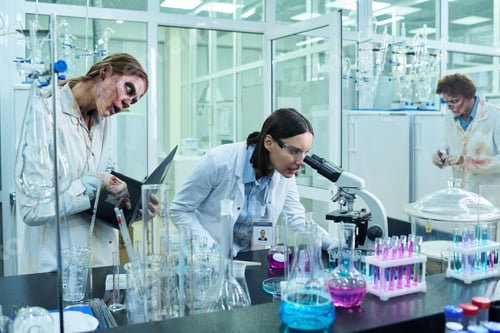 Preview: Young Scientist Working In Lab Full Of Zombie Colleagues