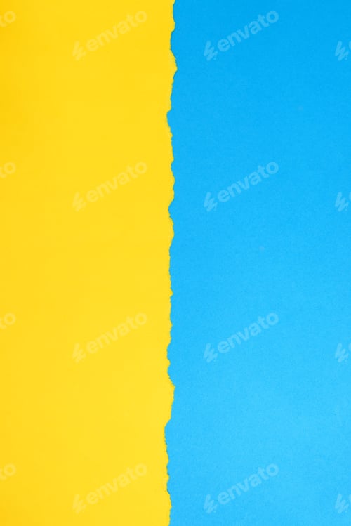 Preview: Yellow torn paper on blue background. Paper texture, background.